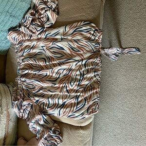 Super stylish Cece blouse with a slight tear in the middle that is hard to see.